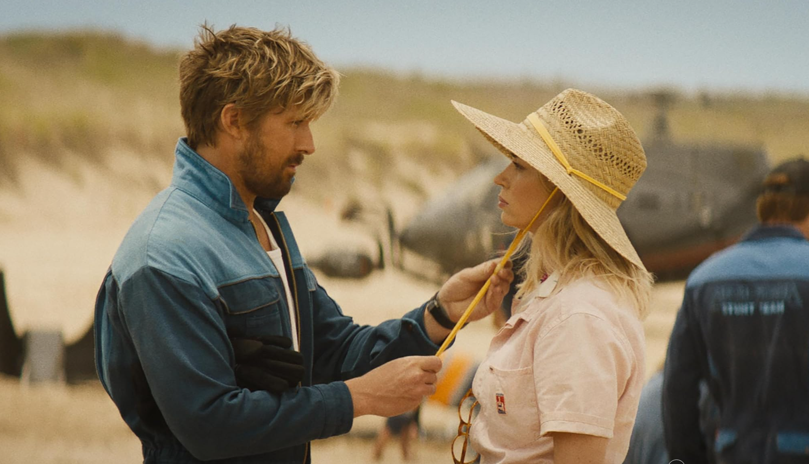 Ryan Gosling and Emily Blunt looking at each other in a scene from the movie The Fall Guy.